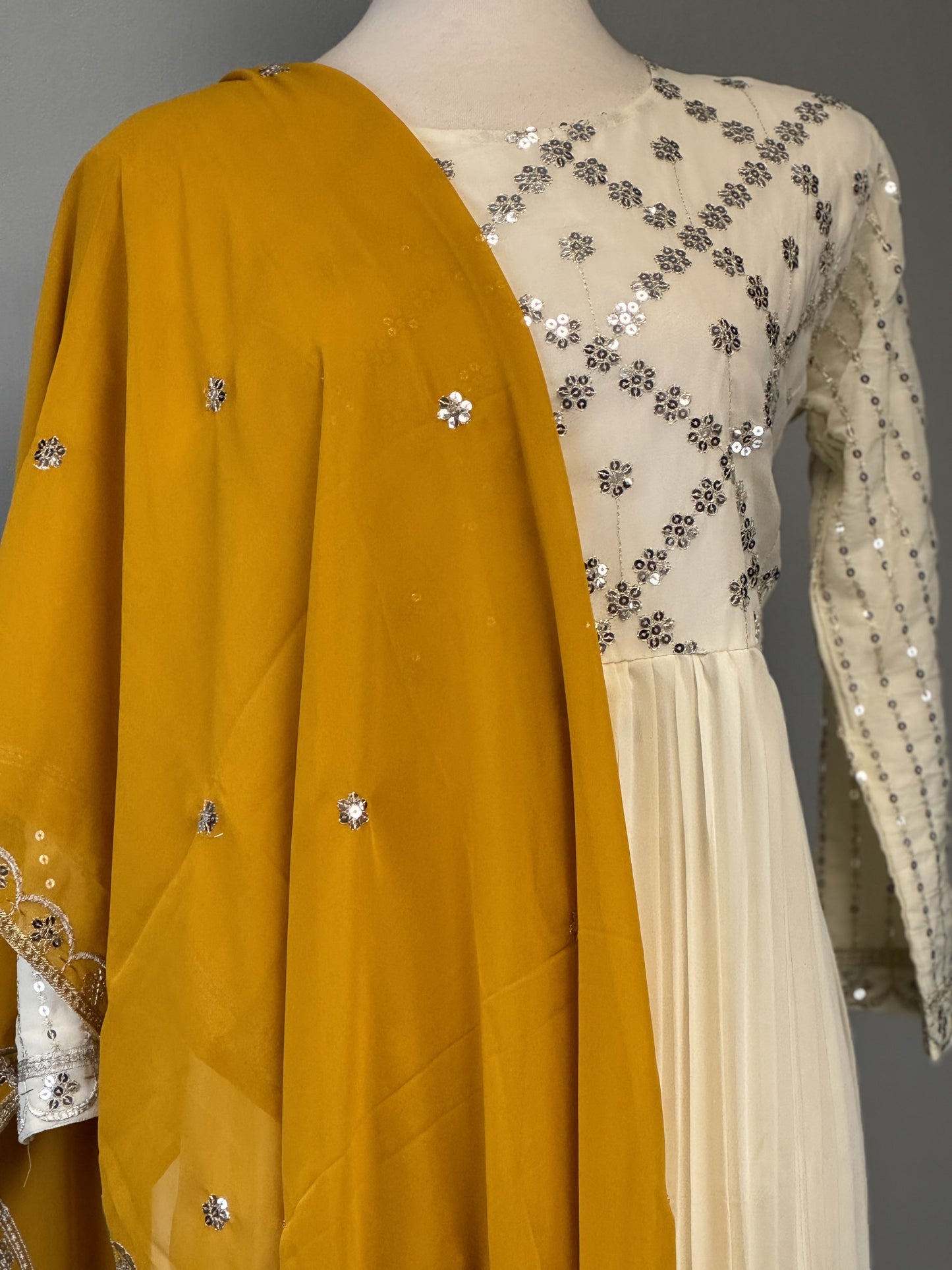 Stunning White Sequined Suit Paired with Vibrant Yellow Dupatta