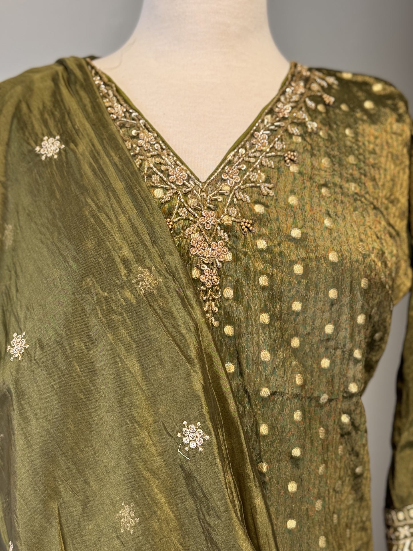 Opulent Olive Green Salwar Suit Featuring Striking Golden Bead Accents