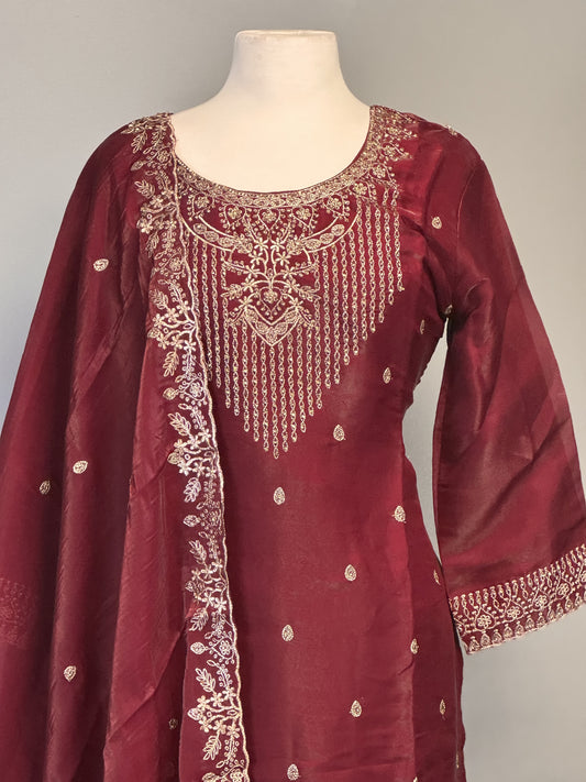 Adorned Maroon Salwar Suit with Golden Bead Accents.